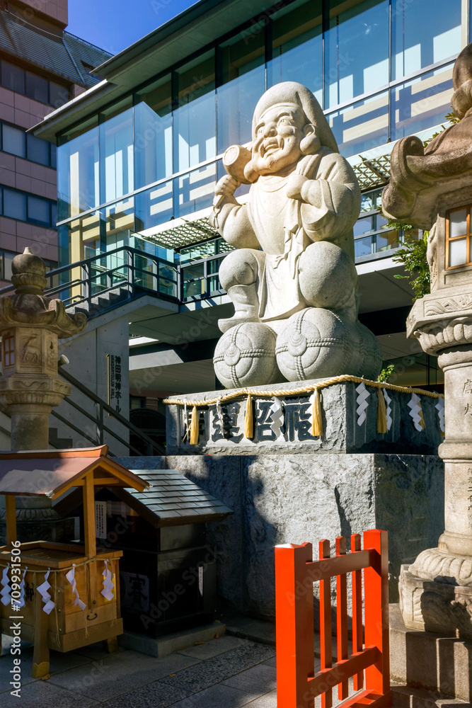 CHIYODA, TOKYO, JAPAN - NOVEMBER 20, 2023: Daikokuten statue in front ...