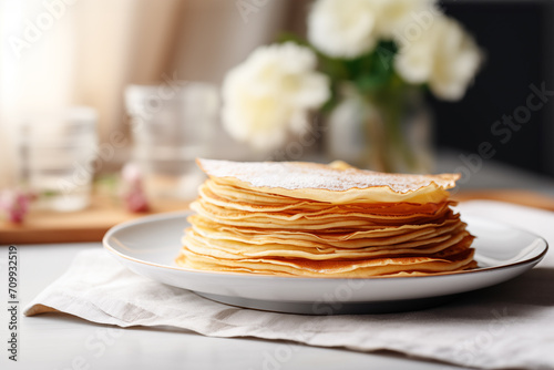 Close up of a stack of crepes (french pancakes) on a plate, Chandeleur celebration