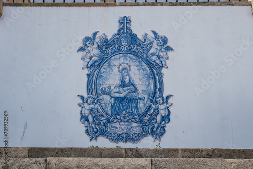 Well-preserved old blue tiles with the inscription Sanctuary of Our Lady of Weeping and commissioned by Queen Santa Isabel, Dornes PORTUGAL photo