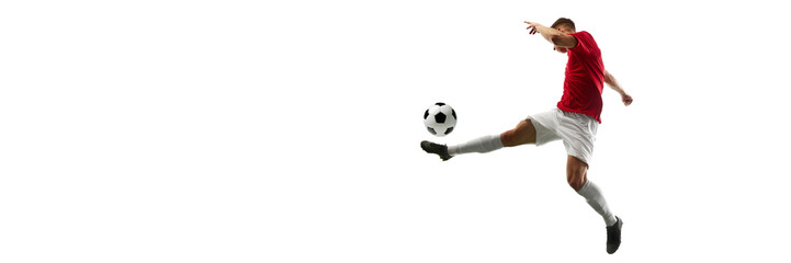 Precision in Flight. Football player kicks ball into air, creating visual masterpiece against white background with negative space to insert text. Concept of sport games, energy, world cup season. Ad