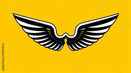 wing emblem for clothing accessories with a yellow background.