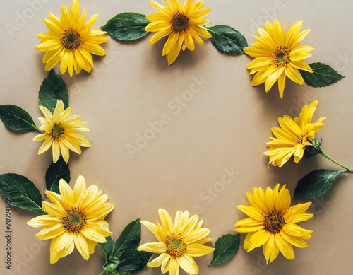 Square frame of star flowers on tan beige background. Flat lay, overhead view