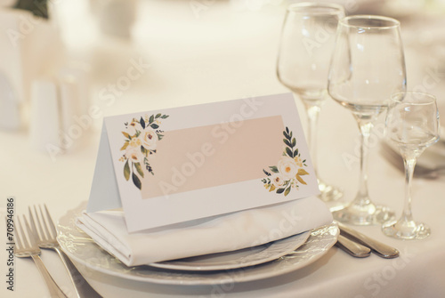 white blank space card, for Name place, Folded, greeting, invitation on wedding table setting background. with clipping path photo