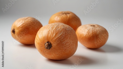 Close-Up View of Rare Orange Fruits with Textured Skin on a White Background