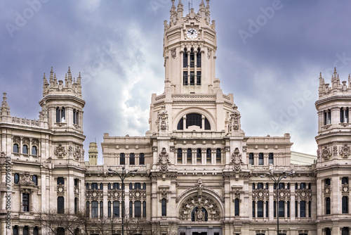 Majestic Cibeles palace serving as Madrid city hall at plaza de Cibeles under cloudy skies.