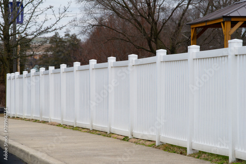 white vinyl fence in residential neighborhood