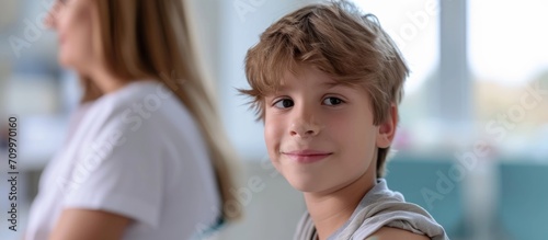 Boy aged 11-12 received HPV vaccine for protection against HPV cancer. photo