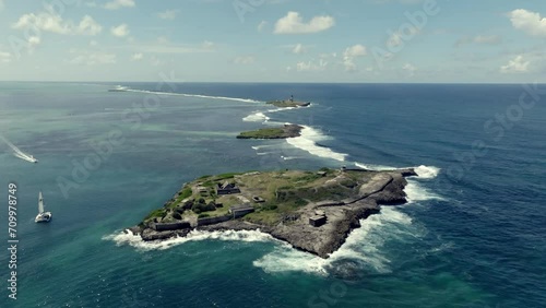 Drone footage over small islands in the Indian Ocean with old ruin. Mauritius photo