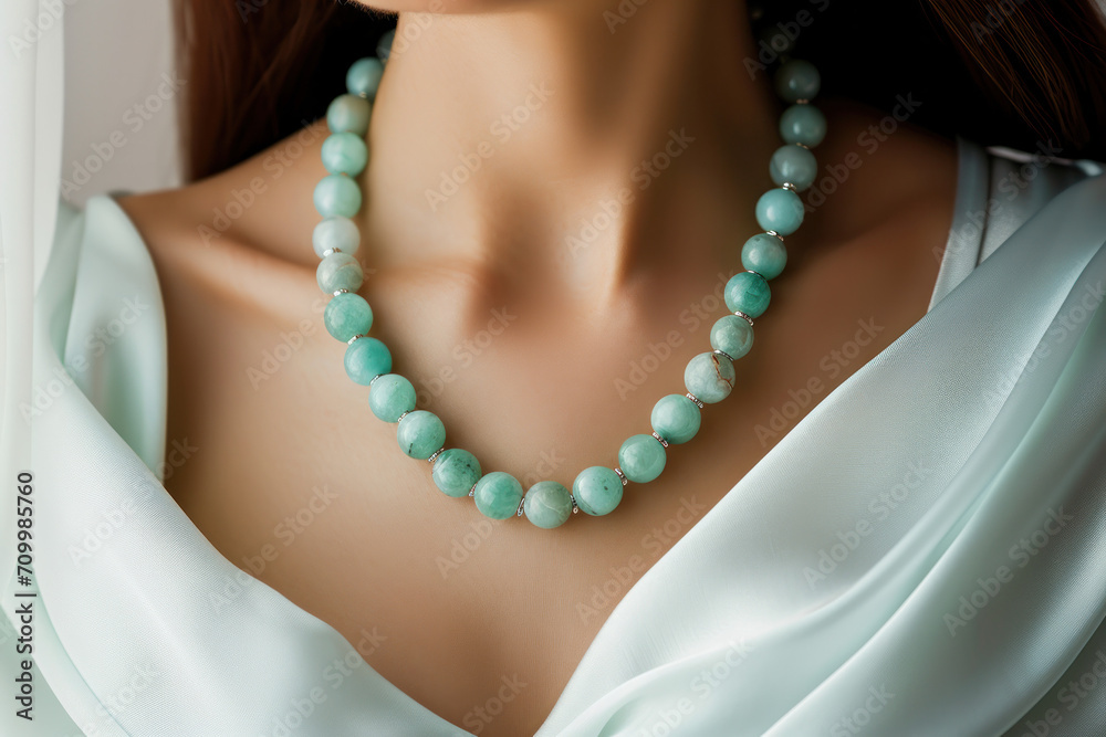 Woman wearing necklace with natural gem stones 