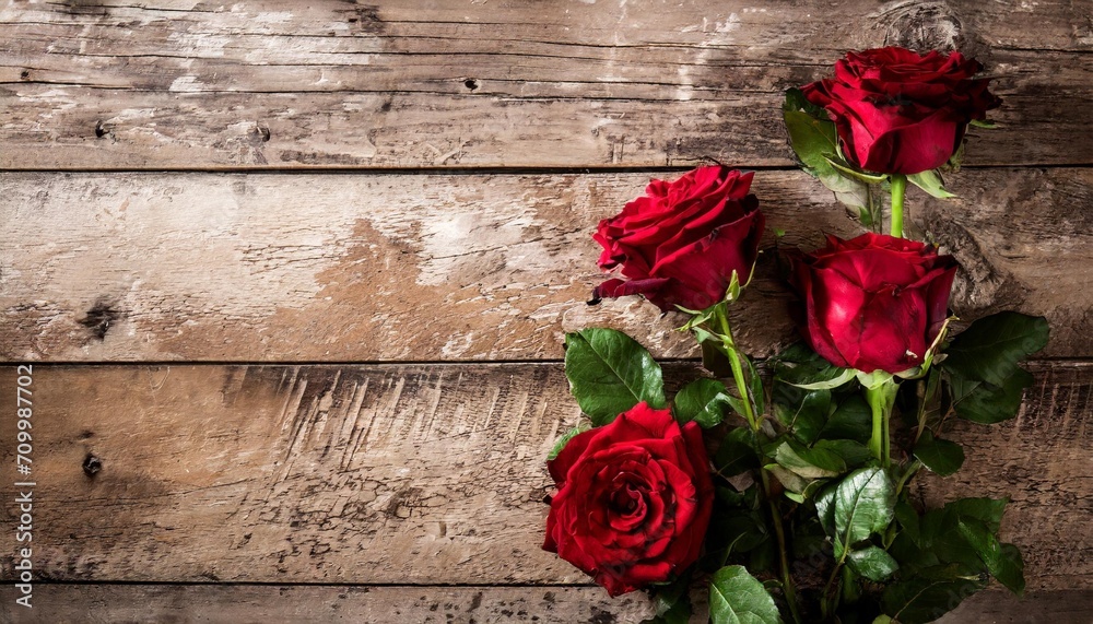 beautiful red roses still life over rustic wooden background love concept shot from above