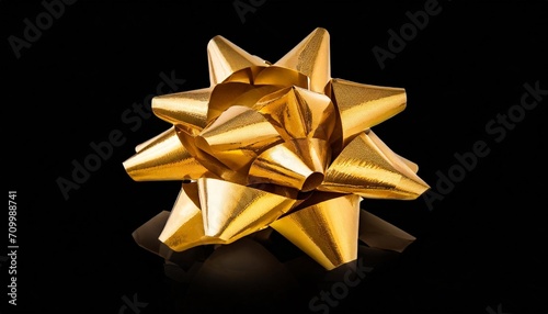 gold gift bow on a black background created with al technology