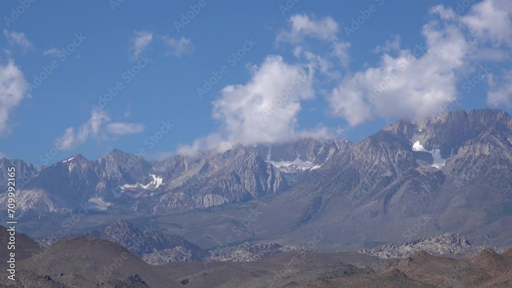 CALIFORNIA - 2023 - Time-lapse of mist moving over the Sierras on a sunny day in California. CALIFORNIA - 2023 - Time-lapse of mist moving over the Sierras on a sunny day in California.