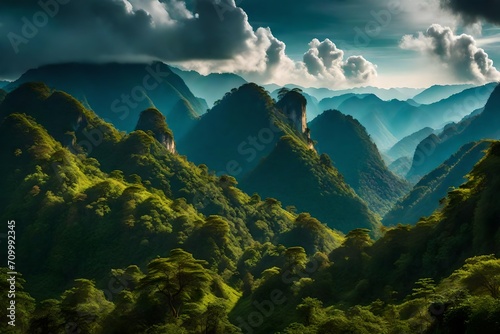 Amazing wild nature view of layer of mountain forest landscape with cloudy sky. Natural green scenery of cloud and mountain slopes background. Maehongson,Thailand. Panorama view. © Hassan
