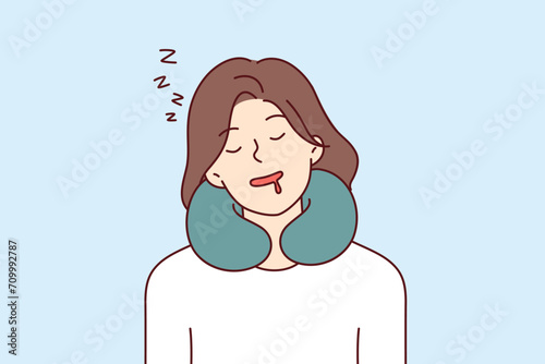 Woman sleeps using neck pillow while traveling and experiences comfort thanks to travel cushion. Sleeping girl with closed eyes and drooling, with pillow to support neck for sedentary rest