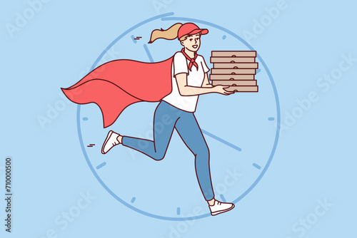 Woman courier with boxes of pizza in hands runs to quickly deliver order to client, dressed in superhero cape. Pizzeria employee near giant clock to advertise italian pizza restaurant