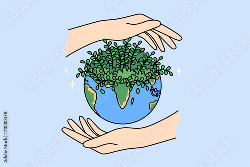 Planet earth and hands of people, caring about preserving environment or ecology of diversity causing plant growth. Ecology day concept to reduce CO2 emissions and combat climate change