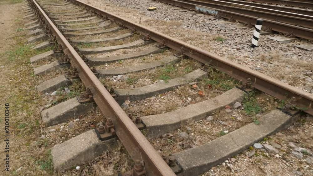 Camera moves forward along the railway tracks, capturing the industrial and Camera moves forward along the railway tracks, capturing the industrial and