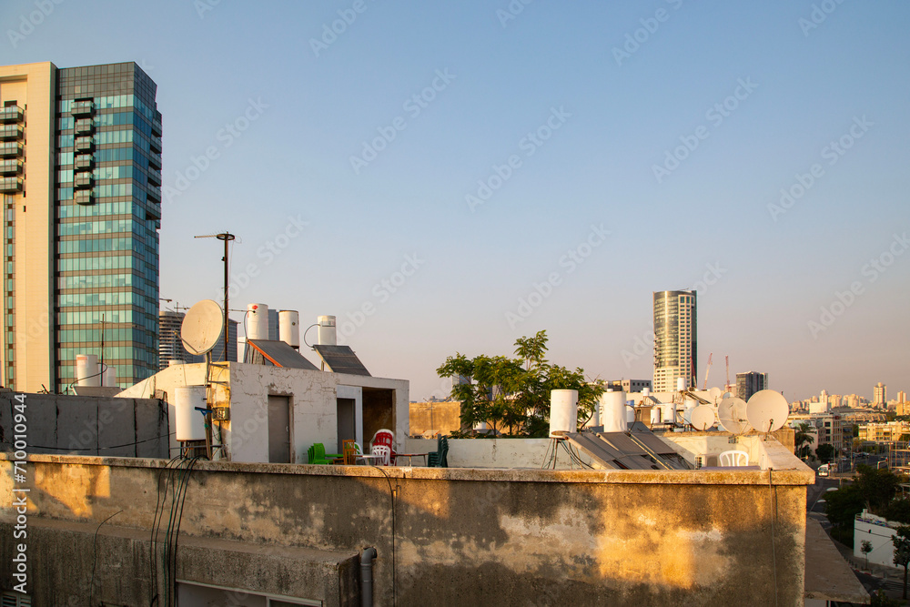 Fototapeta premium Roof top view in poor area of Tel Aviv. South Tel Aviv style of living. Old dirty buildings with boilers.