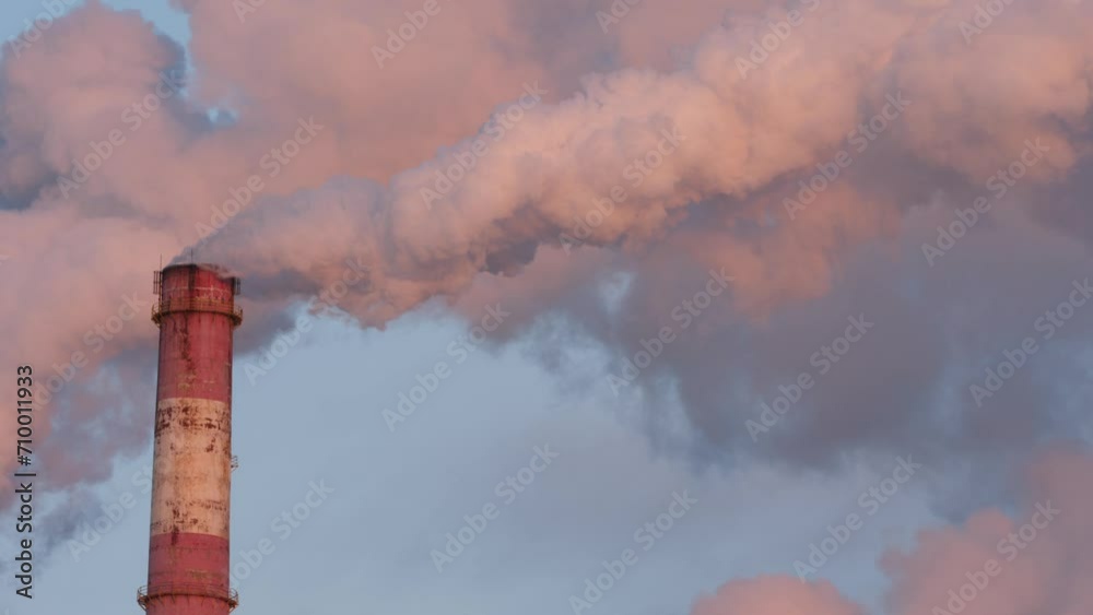 Daytime view of smoke emission from tall chimney. Daytime view of smoke emission from tall chimney.