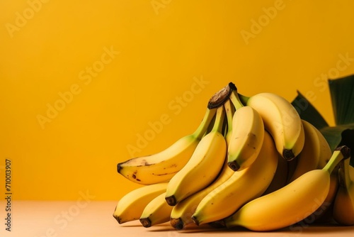 bunch of bananas on a yellow backdrop and empty area. Generative AI