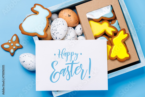 Easter delights: Colorful eggs and gingerbread cookies in a box