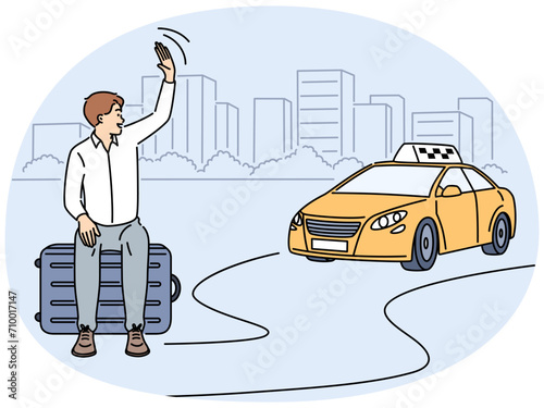 Smiling man waving to taxi driver