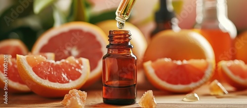 Grapefruit extract in amber bottle with dropper photo