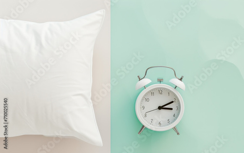 pillow with alarm clock on a pastel background , morning routine, daily schedule concept 