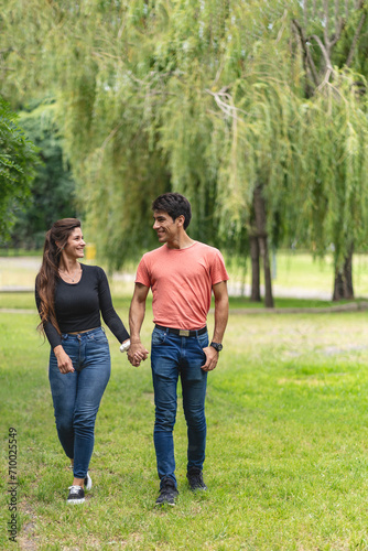 Couple in love walk holding hands in the park © Mariano