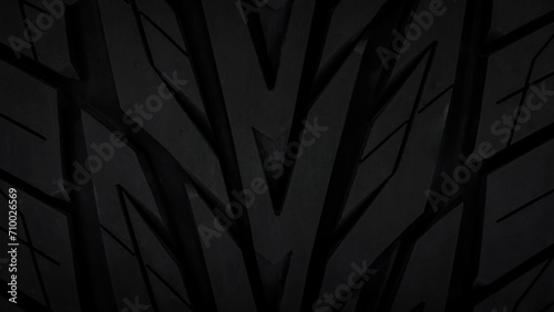 New rubber black car tire with modern tread for black background, abstract background and texture. beautiful patterns, space for work,elegant wallpaper,close up, Horizontal. photo