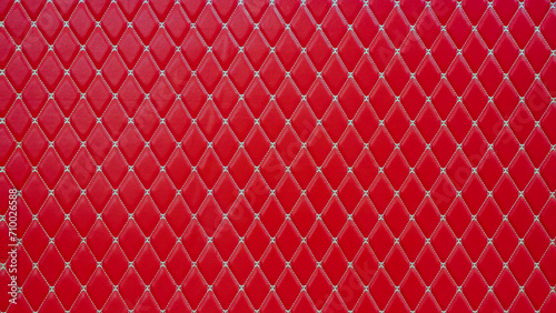 Konstfotografi Genuine luxurious of an elegant vintage geometric pattern red leather seat car, sofa,cushions,upholstered furniture in retro style with white thread pattern, leather padded background