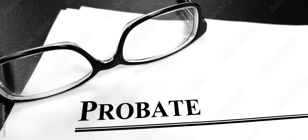 Probate Last Will and Testament Documents on Desk with Glasses Probate Last Will and Testament Documents on Desk with Glasses