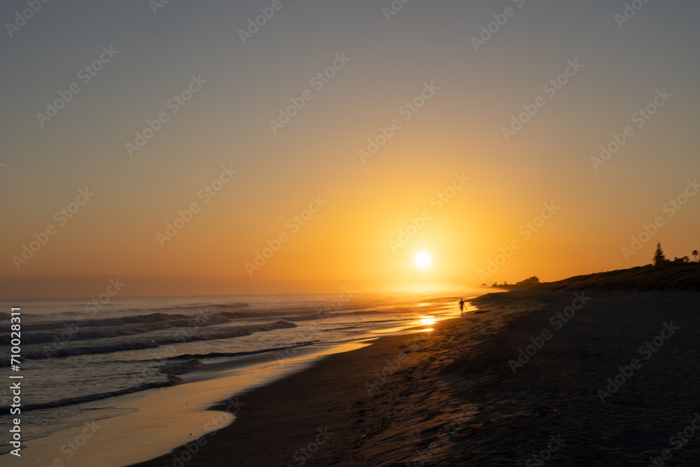 Blurred effect in golden glow of beach sunrise