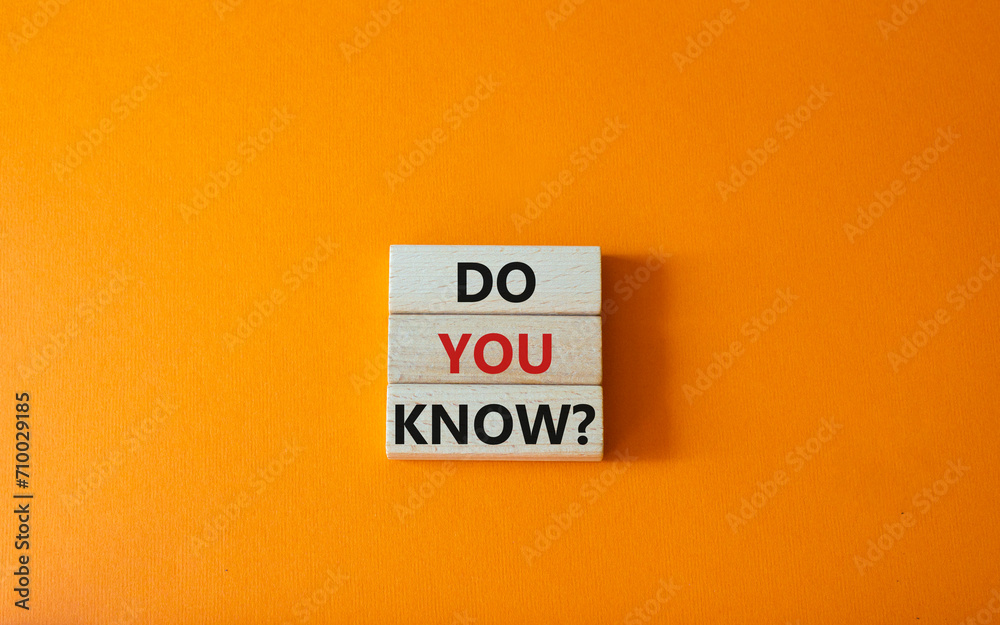 Do you know symbol. Concept word Do you know on wooden cubes. Beautiful orange background. Business and Do you know concept. Copy space.