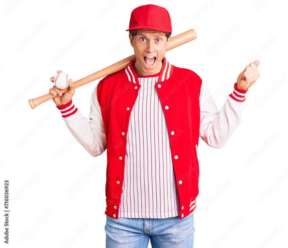 Young handsome man playing baseball holding bat and ball screaming proud, celebrating victory and success very excited with raised arms Young handsome man playing baseball holding bat and ball screaming proud, celebrating victory and success very excited with raised arms