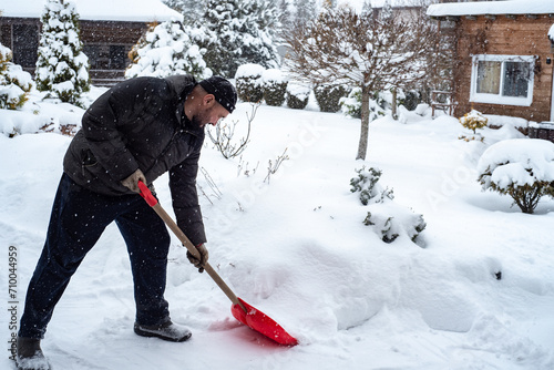 person cleaning snow