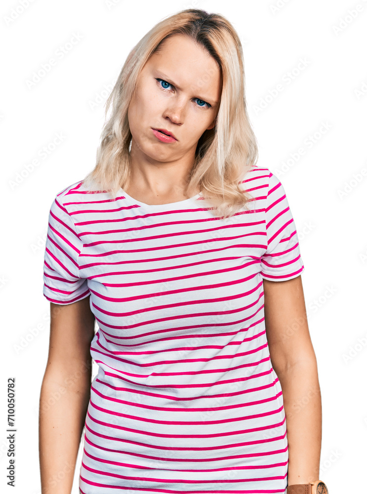 Young caucasian woman wearing casual clothes in shock face, looking skeptical and sarcastic, surprised with open mouth Young caucasian woman wearing casual clothes in shock face, looking skeptical and sarcastic, surprised with open mouth