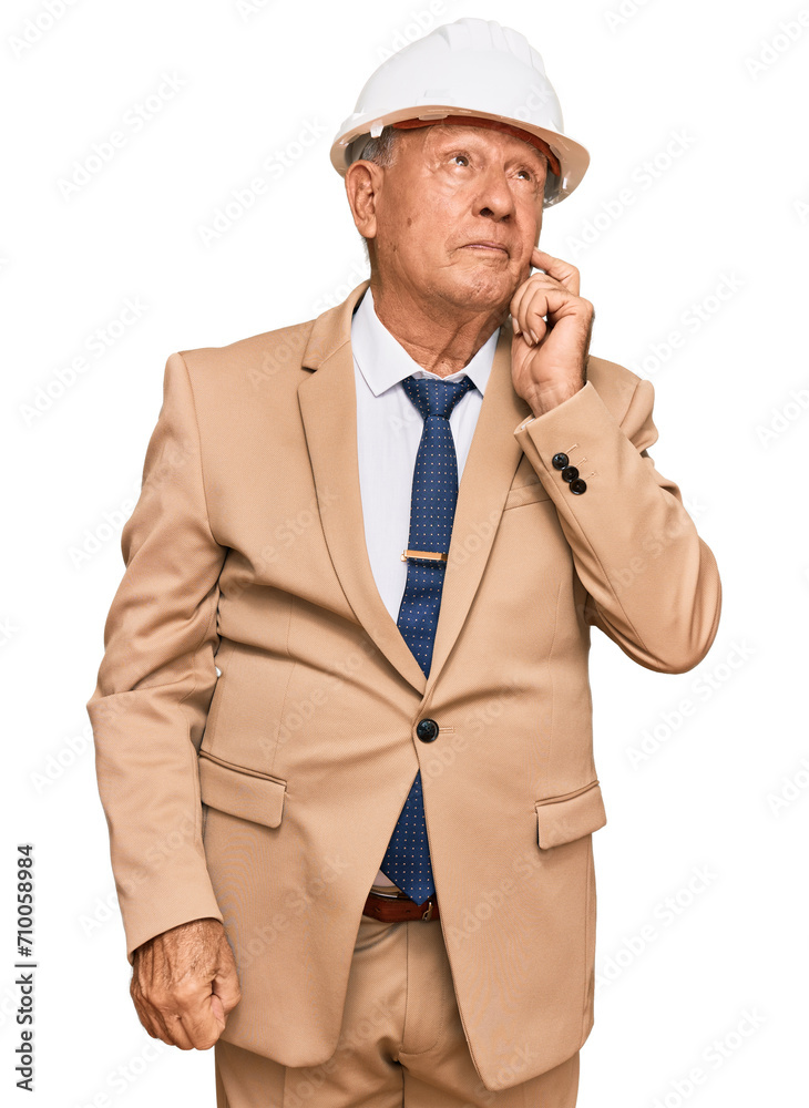 Senior caucasian man wearing architect hardhat serious face thinking about question with hand on chin, thoughtful about confusing idea Senior caucasian man wearing architect hardhat serious face thinking about question with hand on chin, thoughtful about confusing idea