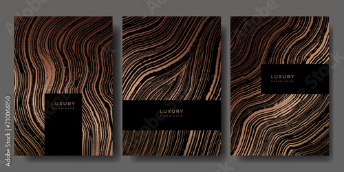 Set of templates. Luxury golden background with wood annual rings texture. Banner with tree ring pattern. Stamp of tree trunk in section. Wooden concentric circles. Black and bronze marble background