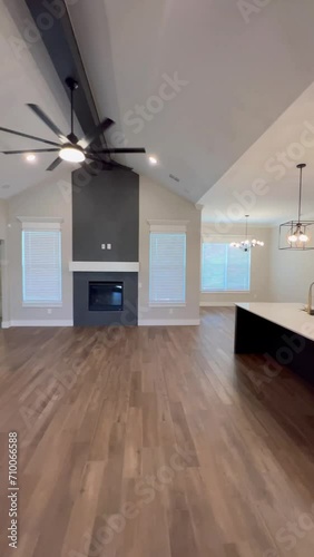 Empty Modern American House Interior with Barn Sliding Doors, Modern Kitchen, Fireplace, Wood Floors Open Space Concept.