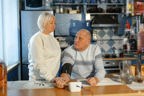 Wallpaper Mural An elderly woman measures her husband's blood pressure and pulse. Torontodigital.ca