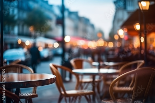 Unfocused cafes, buildings and people. Natural bokeh of city centre view, blurred out of focus background.