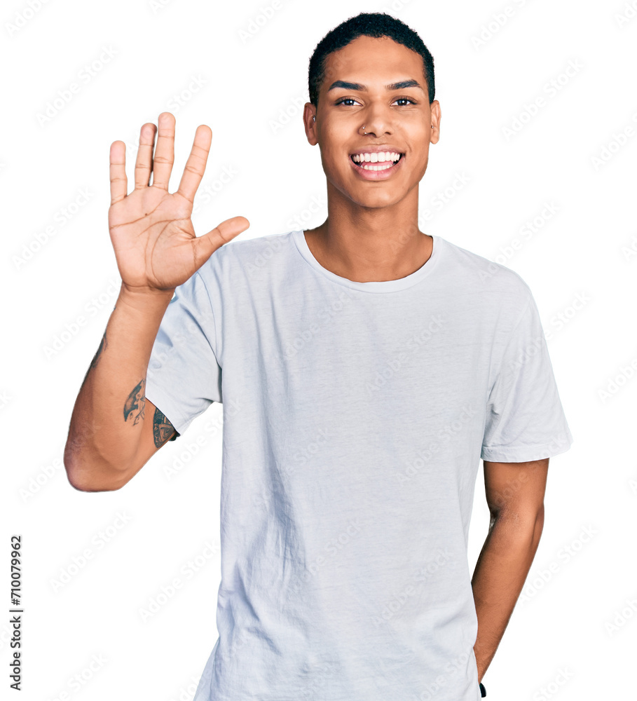 Young hispanic man wearing casual white t shirt showing and pointing up with fingers number five while smiling confident and happy. Young hispanic man wearing casual white t shirt showing and pointing up with fingers number five while smiling confident and happy.