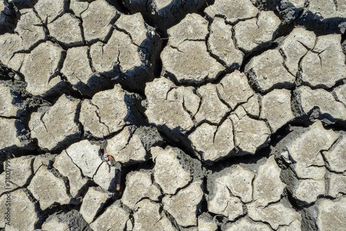 dry and cracked floor of dry river of caldera grande in the city of Barreiro with a small stream. photo