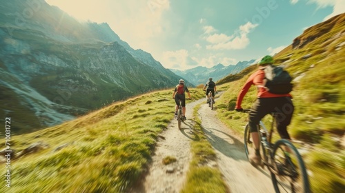 Cyclists riding bicycles on a trail outdoors on a sunny day, motion blur