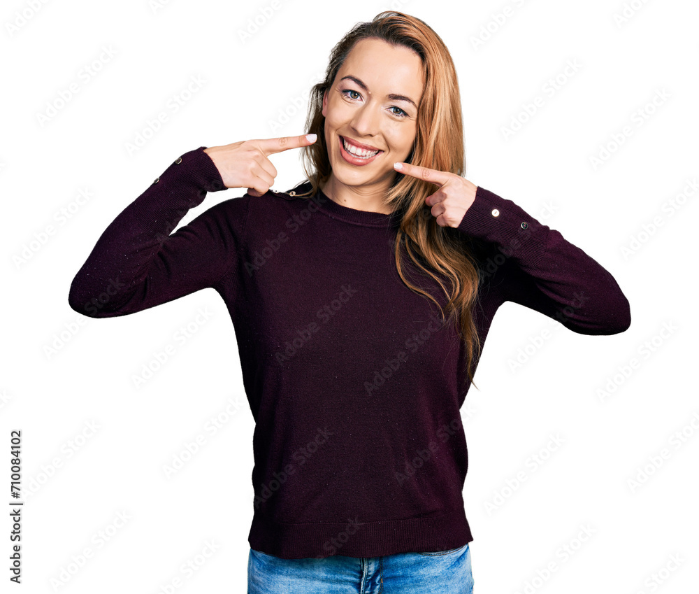 Young caucasian woman wearing casual clothes smiling cheerful showing and pointing with fingers teeth and mouth. dental health concept. Young caucasian woman wearing casual clothes smiling cheerful showing and pointing with fingers teeth and mouth. dental health concept.