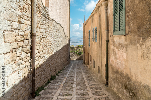 Fototapeta Naklejka Na Ścianę i Meble -  Narrow cobblestone street in the historical center of Erice, province of Trapani in Sicily, Italy