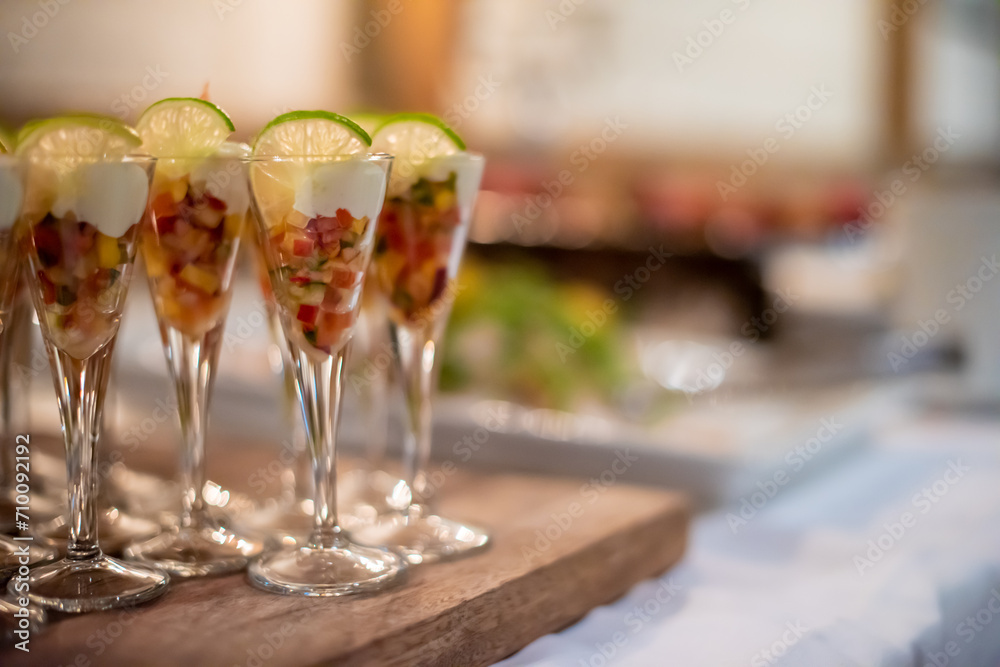 Fruit coctails in glasses at a reception.