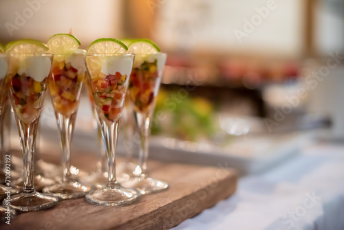 Fruit coctails in glasses at a reception.