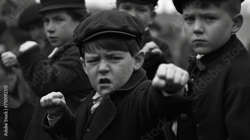 Boys in vintage clothing with fists raised in defiance showing strength and unity 